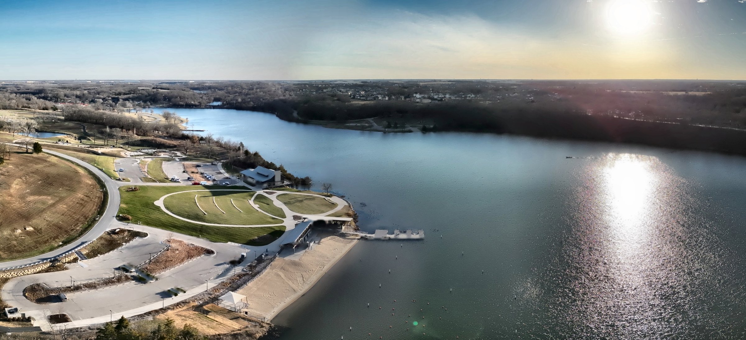 Aerial panorama of Lake Olathe showing the beach house, swim beach, boat dock and park in Olathe, Kansas