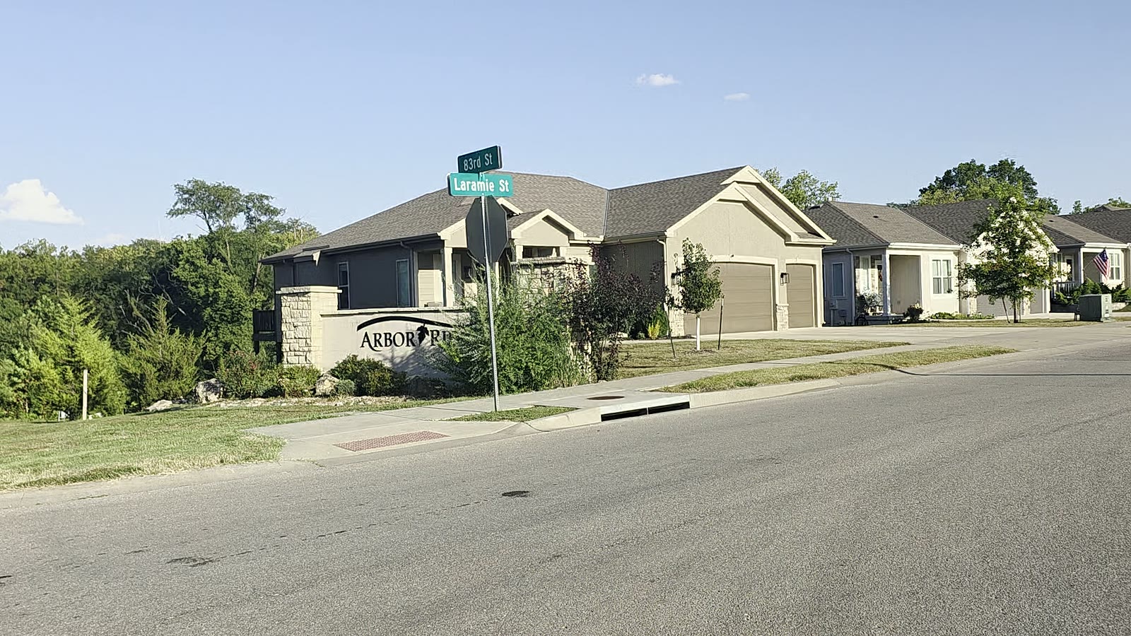 Arbor Ridge stone monument and street signs at the Laramie Street entrance, De Soto, Kansas