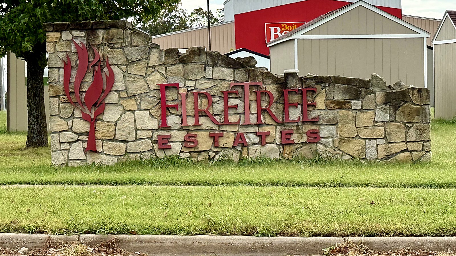 Stone entrance monument lettered Fire Tree Estates in Baldwin City, Kansas