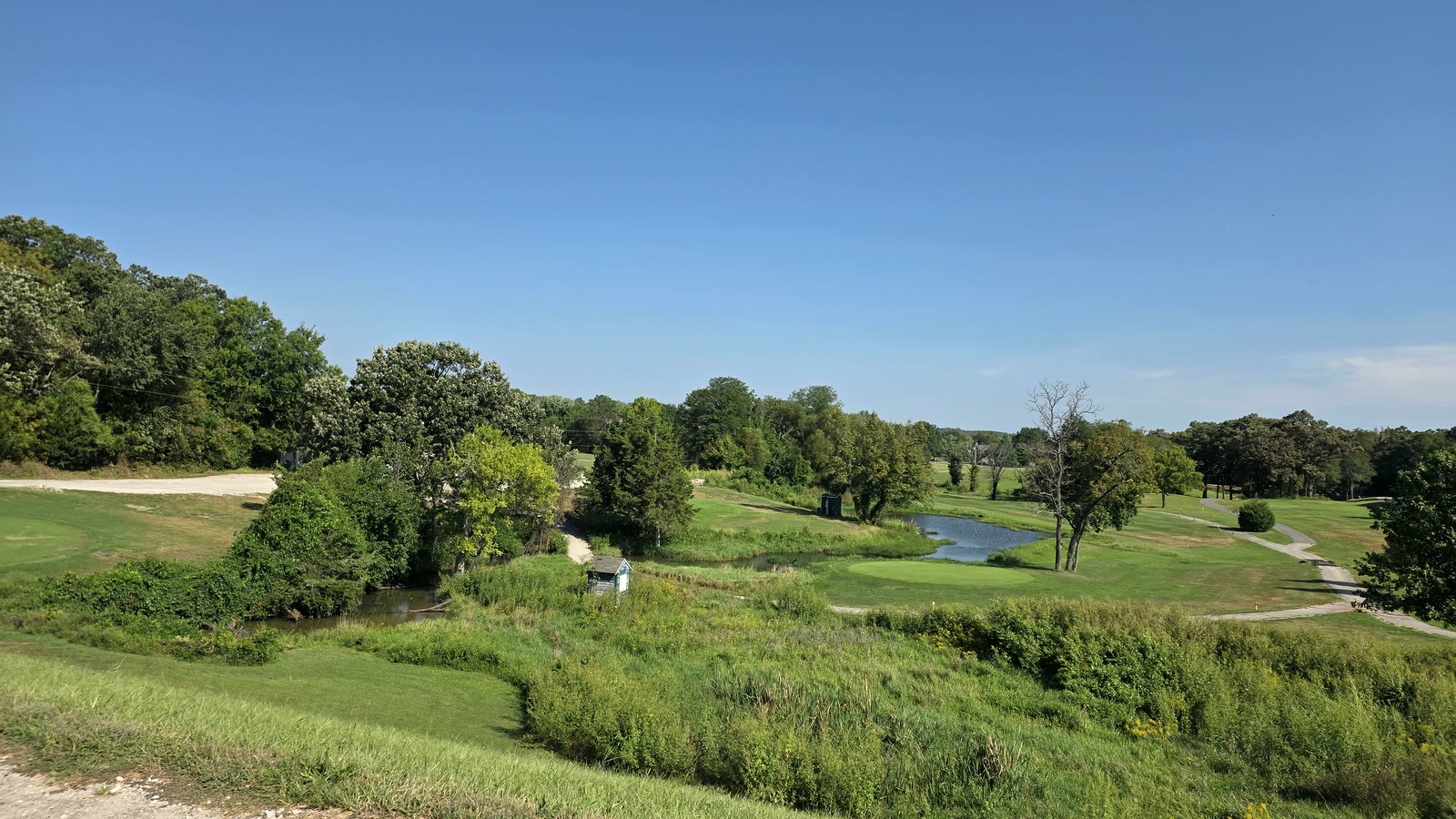Pond and fairways of the golf course bordering Oak Country Estates in De Soto, Kansas